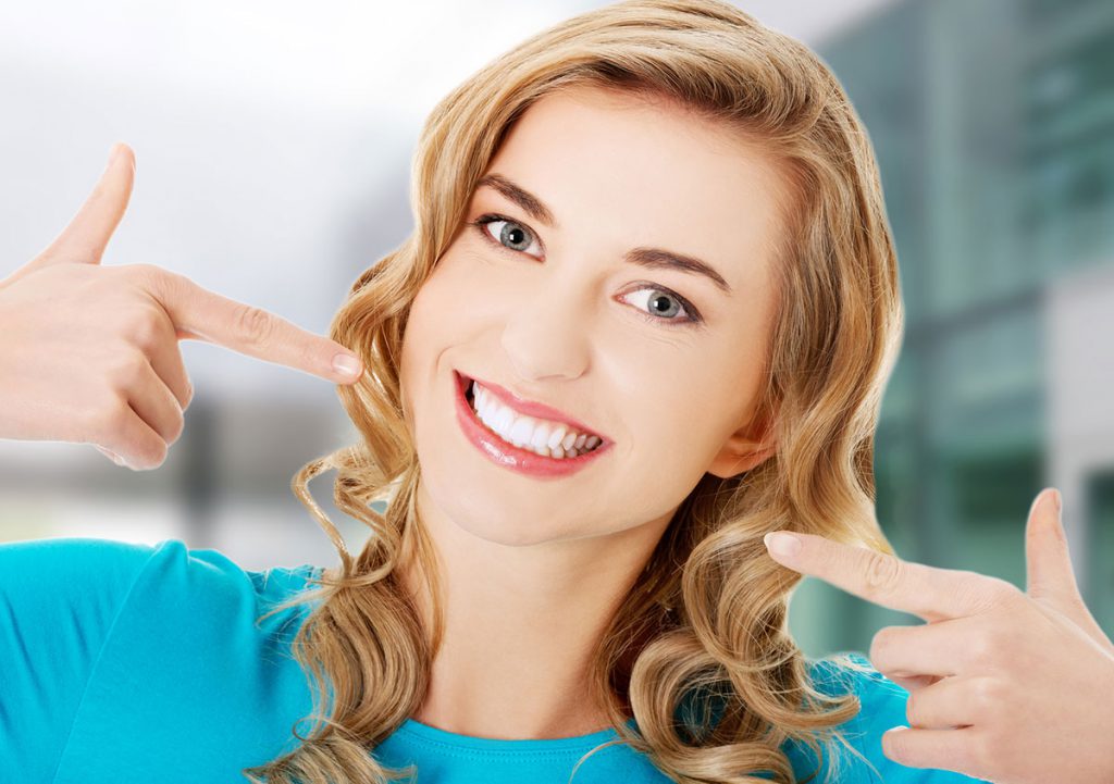 Girl pointing her smile by hands